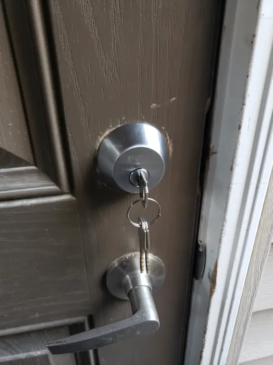 Deadbolt and lever handle with new keys in the lock
