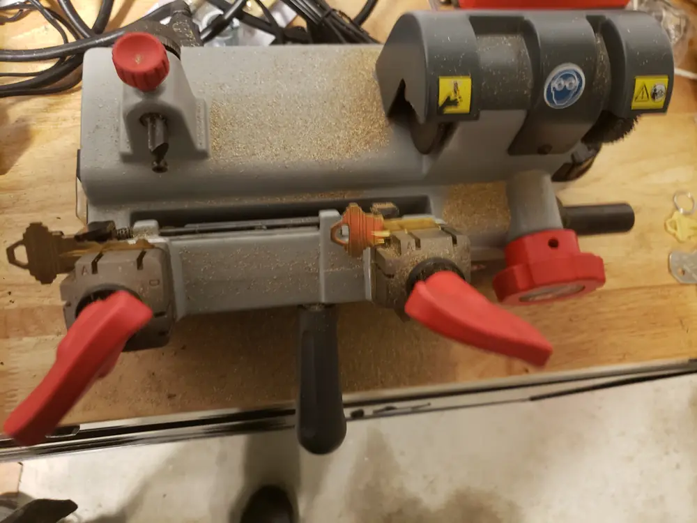 Key duplicating machines on a workbench